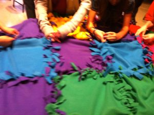 children making blanket